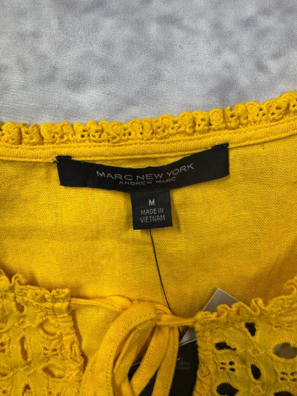 Marc New York yellow eyelet blouse features ruffled cap sleeves and a tassel tie - Picture 2 of 8
